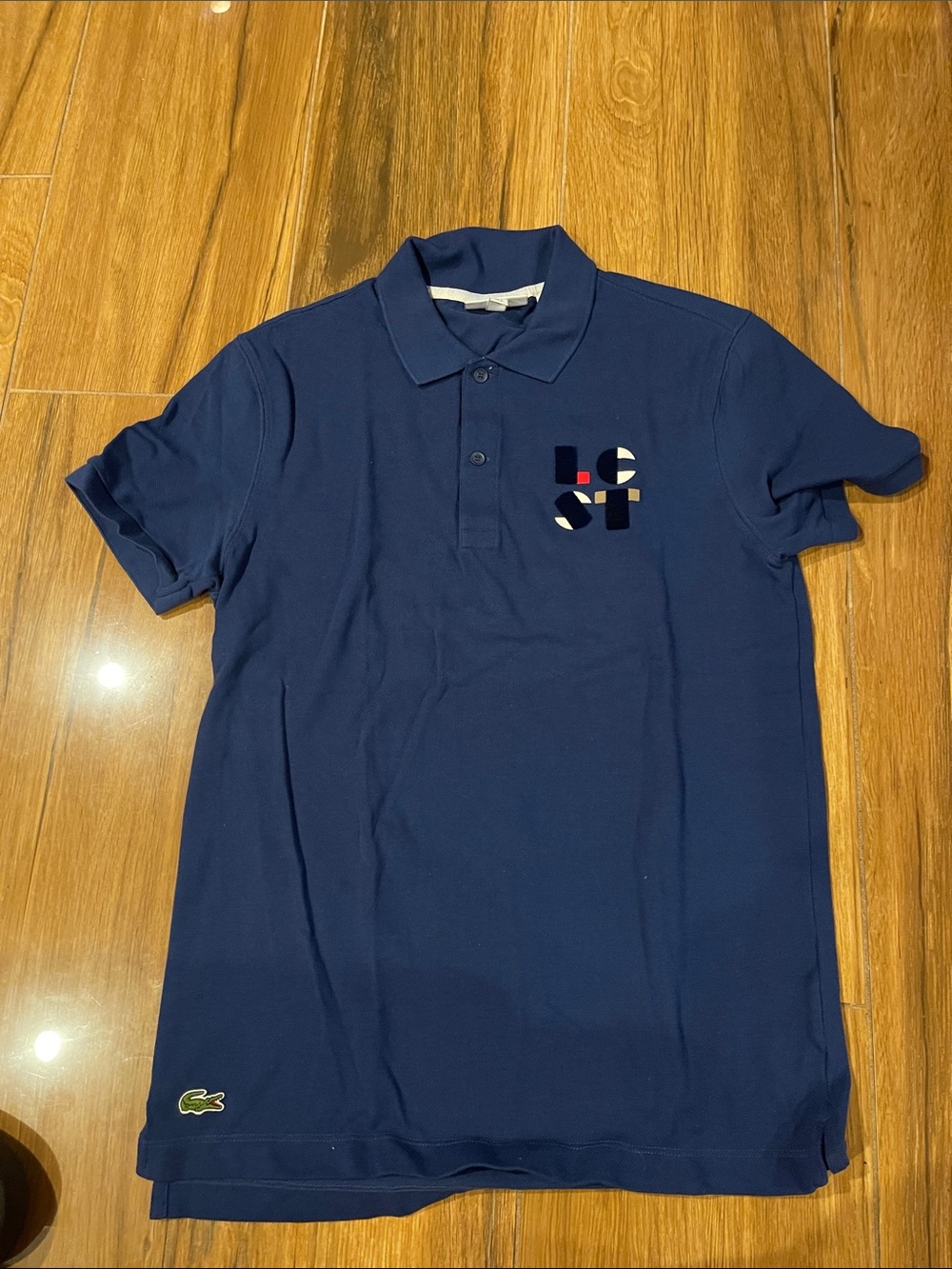 Lacoste Navy Polo with Subtle Chest Graphic